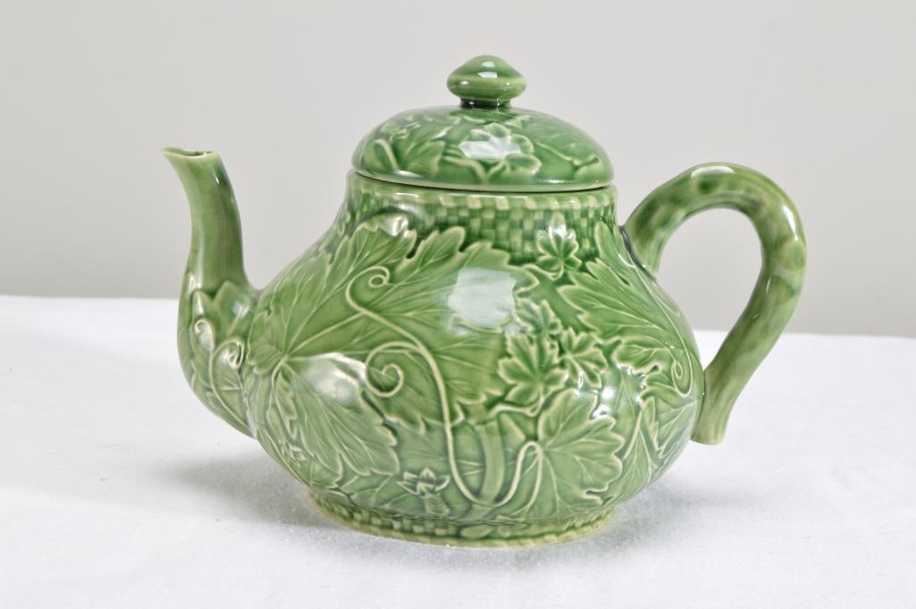 Bordallo Pinheiro Majolica Green Vine Leaf Green Teapot: Marked on base. Dimensions: H 6.5 x W 10 x D 8 inches NOTE: No apparent chips or evidence of repairs.