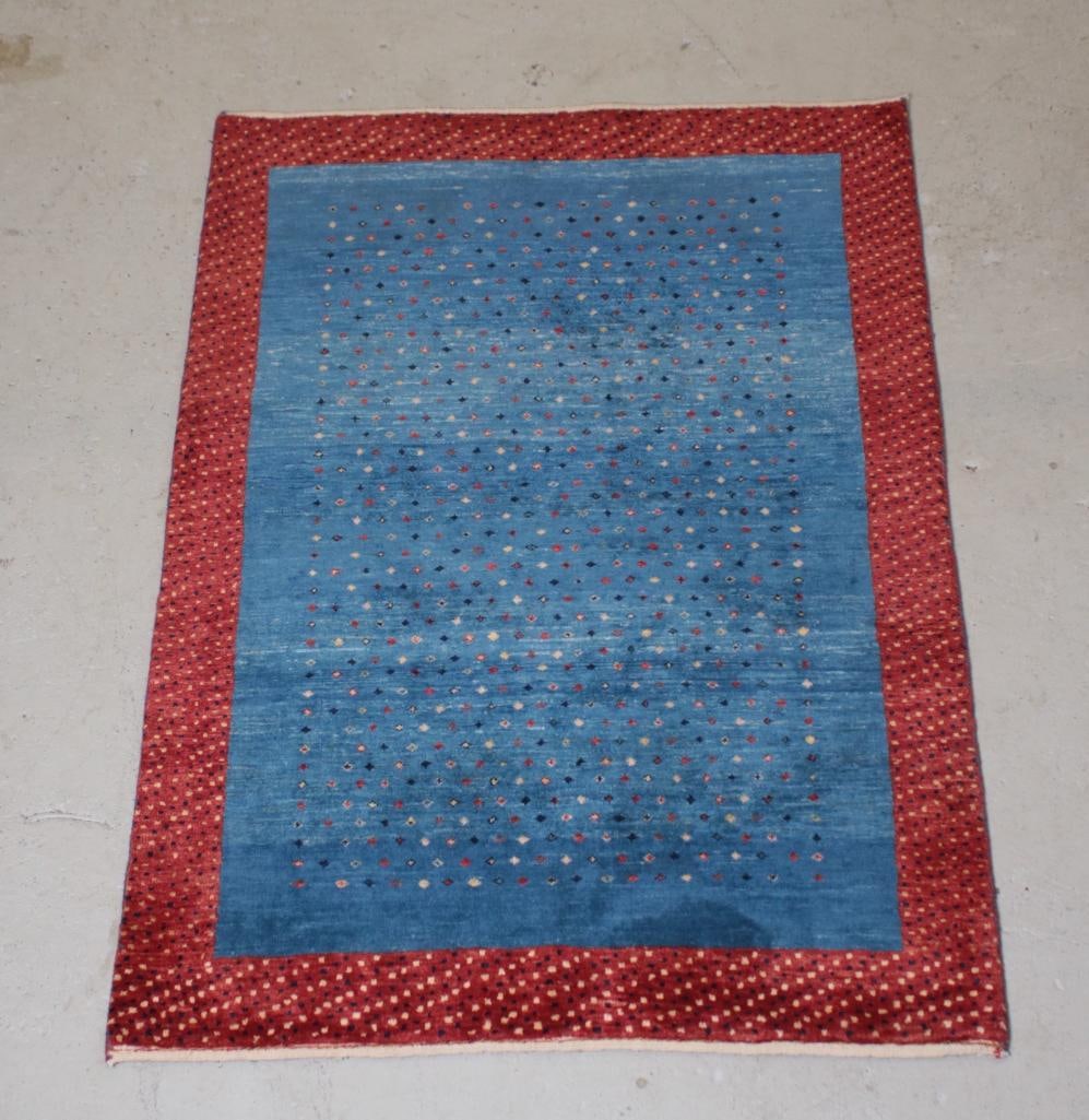 Modern 4' 11" x 3' 5" Gabbeh Rug: Blue ground with red border Dimensions: H 1 x W 59 x D 41 inches NOTE: Good Condition