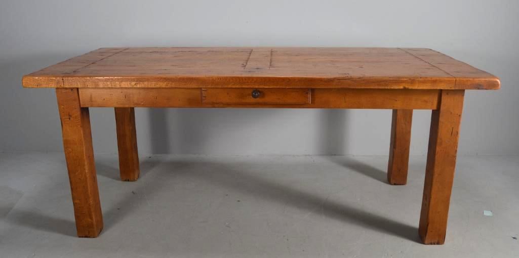 Oak Farm Table: With a rectangular top with breadboard ends, over a apron with drawers, together with two leaves that attach to the ends of the table (Leaves each 20 in) Dimensions: H 29 x W 71 x D 33 inches NOTE: We