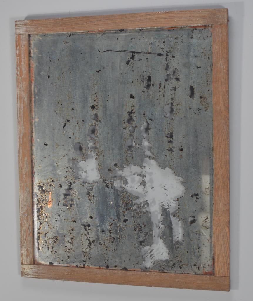 Antique Mirror: With bare wood rails and antique beveled glassDimensions: H 33 x W 26.75 x D 0.5 inchesNOTE: Wear consistent with age and useProperty from an Anchorage, KY home