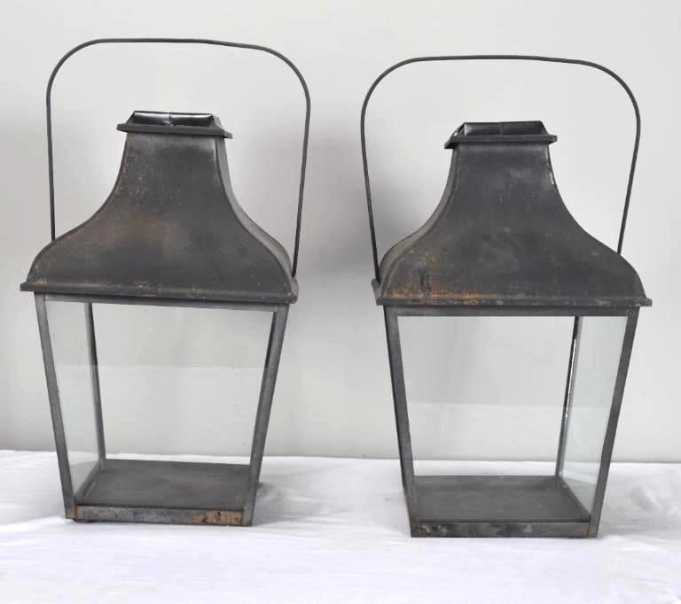 Pair of Tin and Glass Lanterns: Of usual formDimensions: H 20 x W 12 x D 12 inchesNOTE: Wear consistent with age and useProperty from an Anchorage, KY home