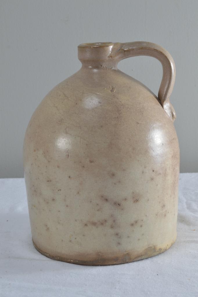 Stoneware Jug: Of usual formDimensions: H 11 x W 8 x D 8 inchesNOTE: No evidence of chips, cracks or repairsProperty from an Anchorage, KY home