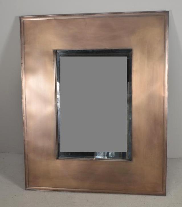 Metal Mirror: Bronze colored tin wide frame with beveled glass Dimensions: H 42 x W 34 x D 1 inches NOTE: No apparent flaws Property from an Anchorage, KY home