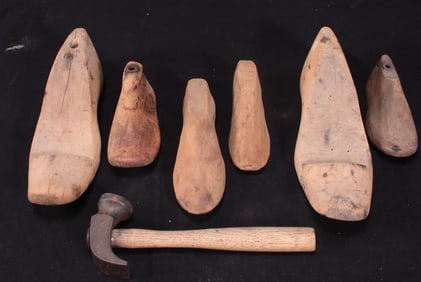 Six Antique Shoe Molds and a Cobbler's Hammer
