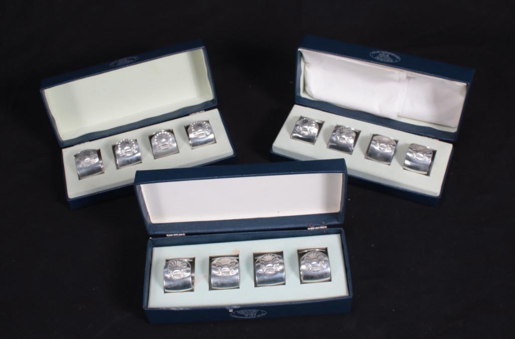 Set of Twelve (12) Old Newbury Pewter Napkin Rings: In three original boxes, each with a scallop shell Dimensions: H 1 x W 1.25 x D 1.25 inches NOTE: In original boxes