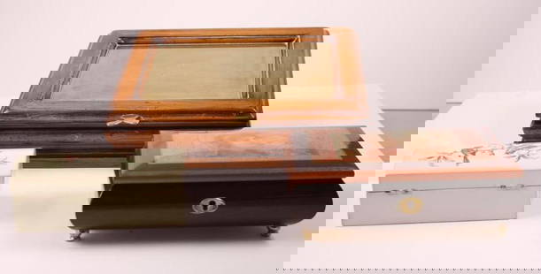 Three Dresser Boxes: One a Edna Hibel Jewelry box, a brass and wood box and a painted wood box. Measurements for the largest. Dimensions: H 3 x W 11 x D 8.5 inches NOTE: Wear consistent with age and use