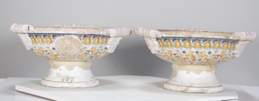 Pair of Italian Pottery Garden Tazza: Each with three handles and decorations of lemons. Dimensions: H 8 x W 16 x D 16 inches NOTE: Dirty from being in garden, with small chips and cracks
