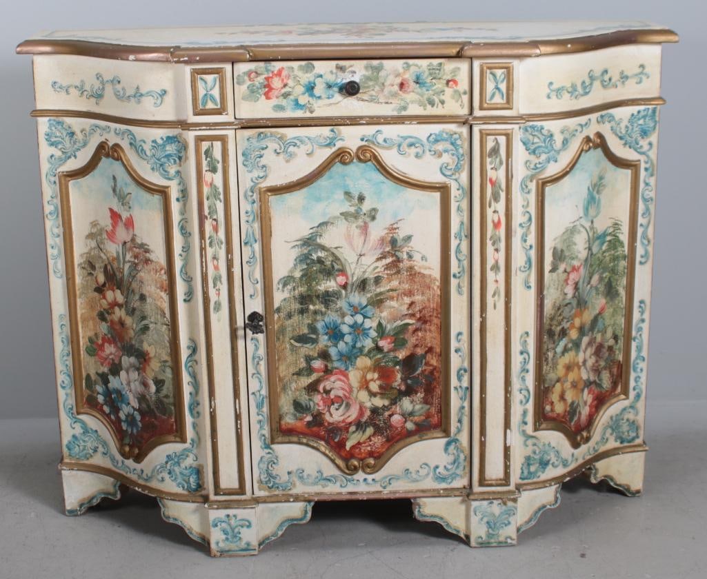 Polychrome Demilune Table: With a shaped and moulded top over a single drawer over a central door with panel of foliage, rased on six bracket feet Dimensions: H 33 x W 41 x D 12 inches NOTE: Wear consistent with age and use