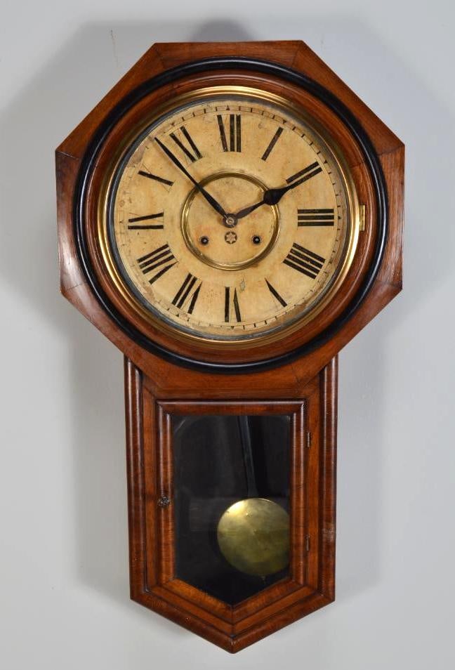 New Haven 8 Day Regulator Clock: American New Haven, "Harvard" oak 8 day Regulator long Drop clock with pentagon shaped glass, Roman numerals, discoloration to the dial, with key Dimensions: H 32 x W 17.5 x D 4 inches NOTE: