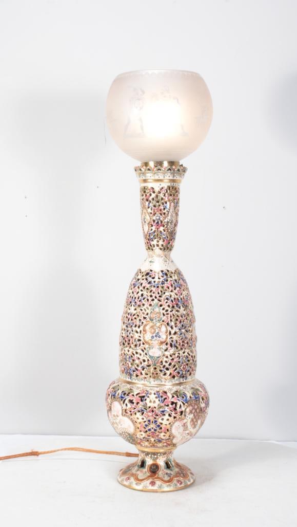 Pierced Porcelain Lamp: With a frosted, etched bulbous shade over a double gourd form pierced and painted body, raised on a round foot. Dimensions: H 28 x W 8 x D 8 inches NOTE: Tested and working