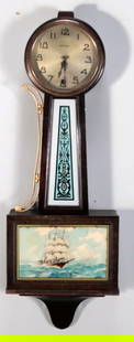 New Haven Banjo Clock: With arabic numeral face over a painted body, the base with a reverse painting of a ship signed &#34;JW&#34;  Dimensions: H 29 x W 10 x D 4 inches  NOTE: One side decoration not affixed