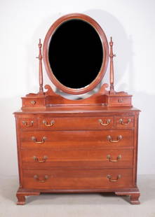 George III Style Cherry Chest of Drawers: With an oval mirror over two drawers, over a rectangular top, over three drawers and four full drawers, raised on bracket feet. By Willett Furniture Dimensions: H 73 x W 44 x D 21 inches NOTE: