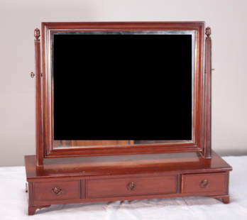 George III Style Mahogany Dressing Mirror: With a rectangular glass framed in a moulded frame over a pedestal with three drawers, raised on bracket feet. By Willett Furniture Dimensions: H 25 x W 27 x D 9.5 inches NOTE: Wear consistent