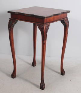 George II Style Mahogany Side Table: With a shaped square top over a plain apron, raised on four carved cabriole legs ending in ball and claw feet Dimensions: H 28 x W 18 x D 18 inches NOTE: Top finish shows wear