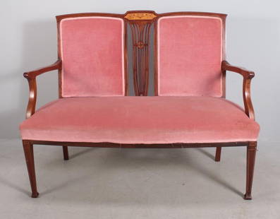 Regency Style Inlaid Mahogany Settee: With a shaped crestrail over two upholstered backs flanking a pierced and inlaid splat, the upholstered seat flanked by shaped arms and stumps, raised on four inlaid and tapering legs ending in pad