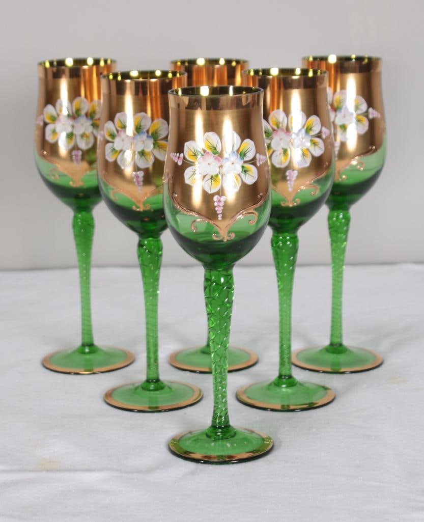Six (6) Bohemian Crystalex Hand Decorated Glasses: Green glass with parcel gilt decoration and handpainted flowers Dimensions: H 8.25 x W 2.75 x D 2.75 inches NOTE: In original packaging