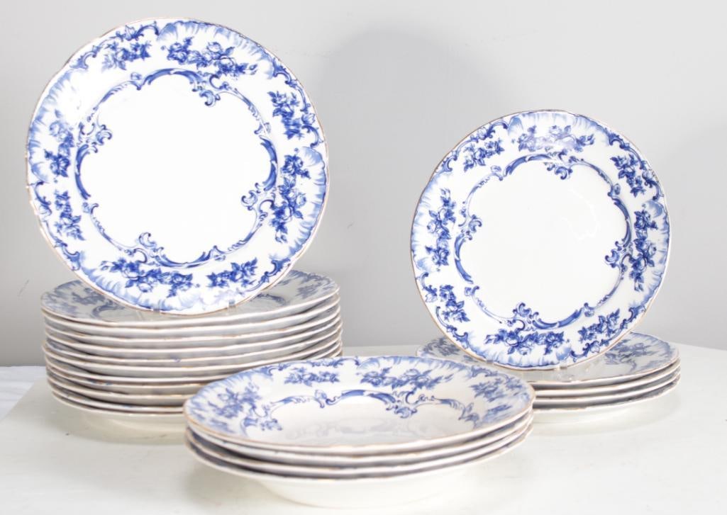 Blue and White Ridgways Partial Dinner Service: Cobalt blue floral swag and scroll pattern (Lorraine Pattern), includes: twelve (12) dinner plates (9 in.), five (5) bread plates (8 in.) and four (4) soup bowls (9 in.). Dimensions: H 9 x W 9 x D 2