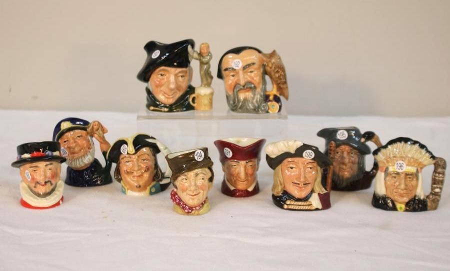 Eight Royal Doulton Character Toby Jugs: A collection of eight Royal Doulton character jugs, earthenware, hand-painted. The first, a Beefeater figure in scarlet uniform and black hat. The second, a figure identified as Tony Weller, in a blue