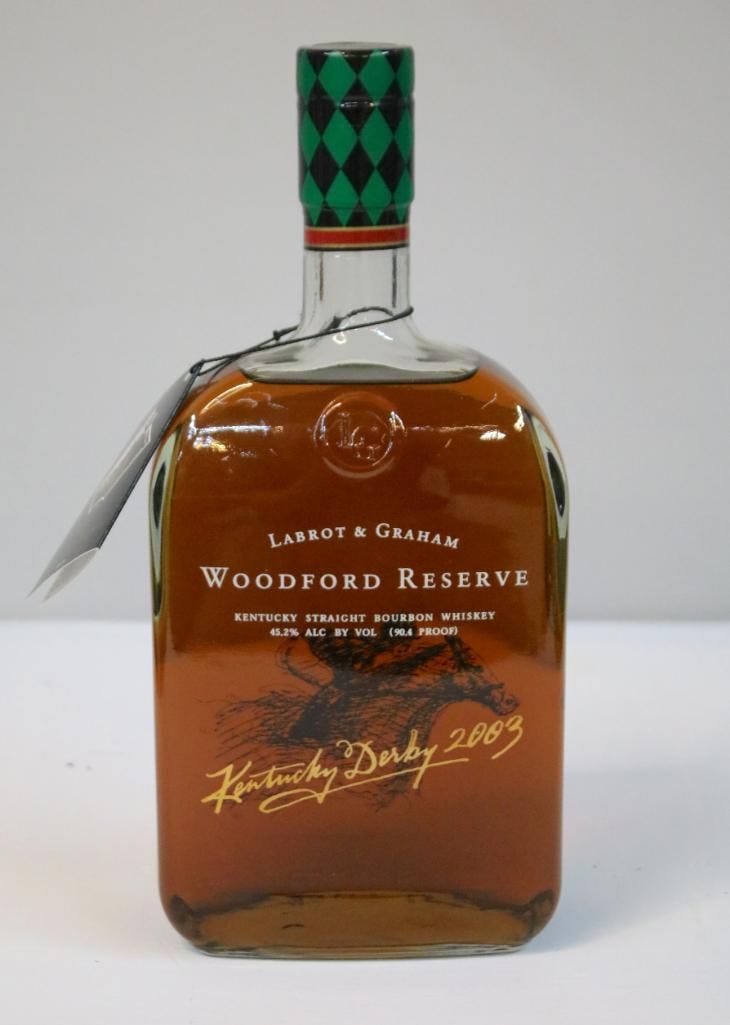 Woodford Reserve - Kentucky Derby 129 Bottle - 2003: Woodford Reserve - Kentucky Derby 129 Bottle - 2003This is a sealed 1.0 liter bottle of Woodford Reserve Distiller’s Select Kentucky Straight Bourbon Whiskey issued for the 2003 Kentucky Derby, prod