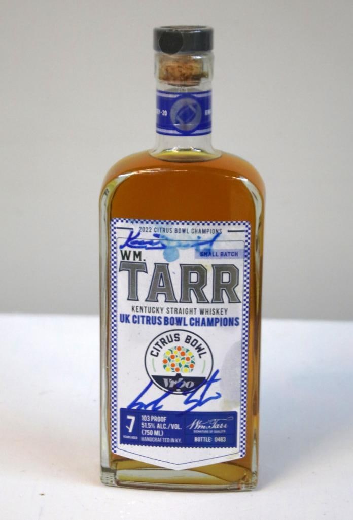 Wm. Tarr 2022 UK Citrus Bowl Champions Bottle: Wm. Tarr 2022 UK Citrus Bowl Champions Bottle Bottle # 0483. Signed but illegible. Wm. Tarr Kentucky Straight Whiskey, small batch, 7 years aged, 103 proof (51.5% alc./vol.), 750 ml, bottled in Harrod