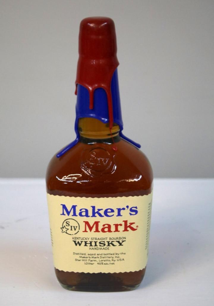 Maker’s Mark - UK vs. UL 2001 Rivalry Game Bottle: Maker’s Mark - UK vs. UL 2001 Rivalry Game BottleMaker’s Mark Kentucky Straight Bourbon Whisky, 45% alc./vol., standard 1.0 liter bottle featuring a red and blue double-wax capsule. The side label