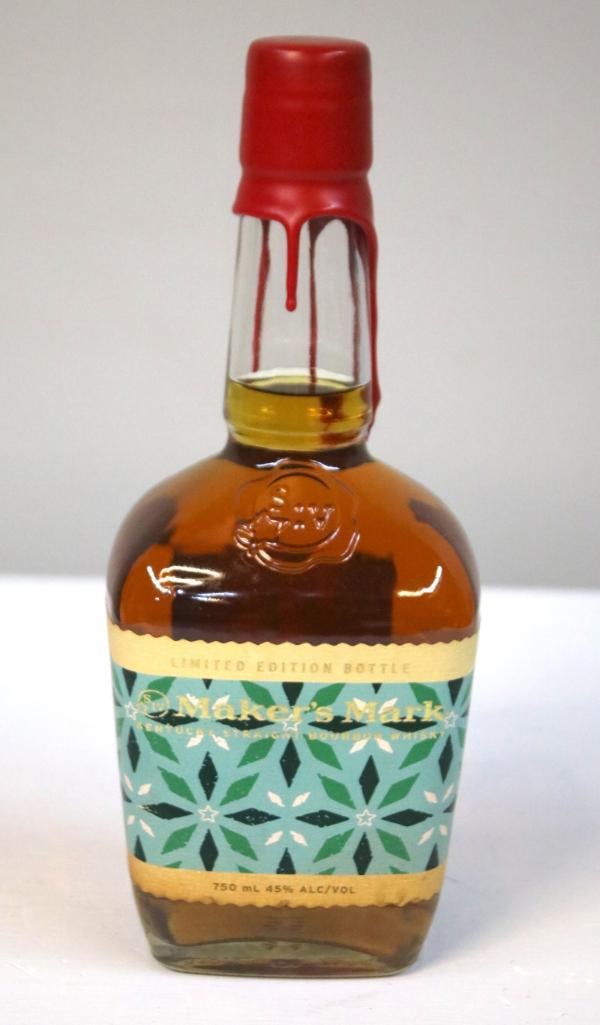 Maker's Mark 2022 Holiday Limited Edition Bottle: Maker's Mark 2022 Holiday Limited Edition BottleA limited-edition label released for the 2022 holiday season. The label has a unique green, black, and white geometric pattern inspired by a collabo