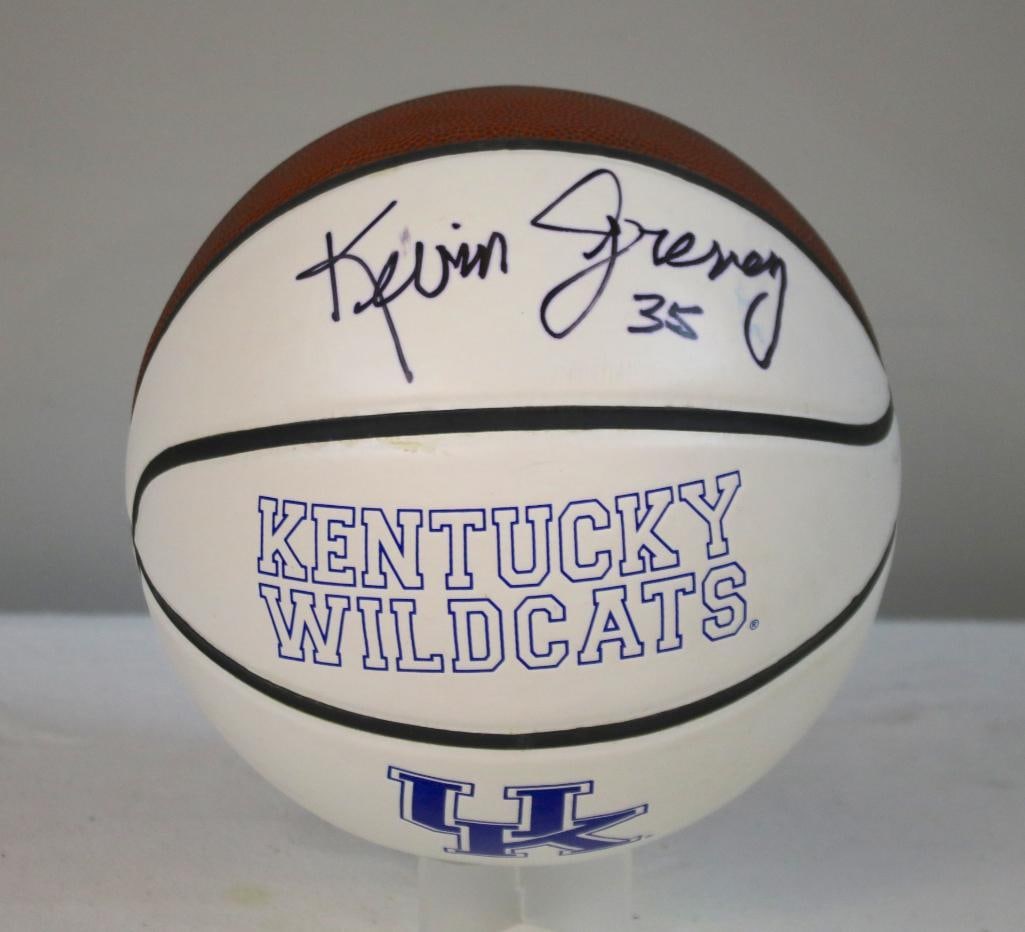 Kevin Grevey Signed UK Basketball: Kentucky Wildcats basketball with blue “KENTUCKY WILDCATS” lettering and UK logo, signed in black marker “Kevin Grevey 35” across the upper white panel. The signature displays minor in