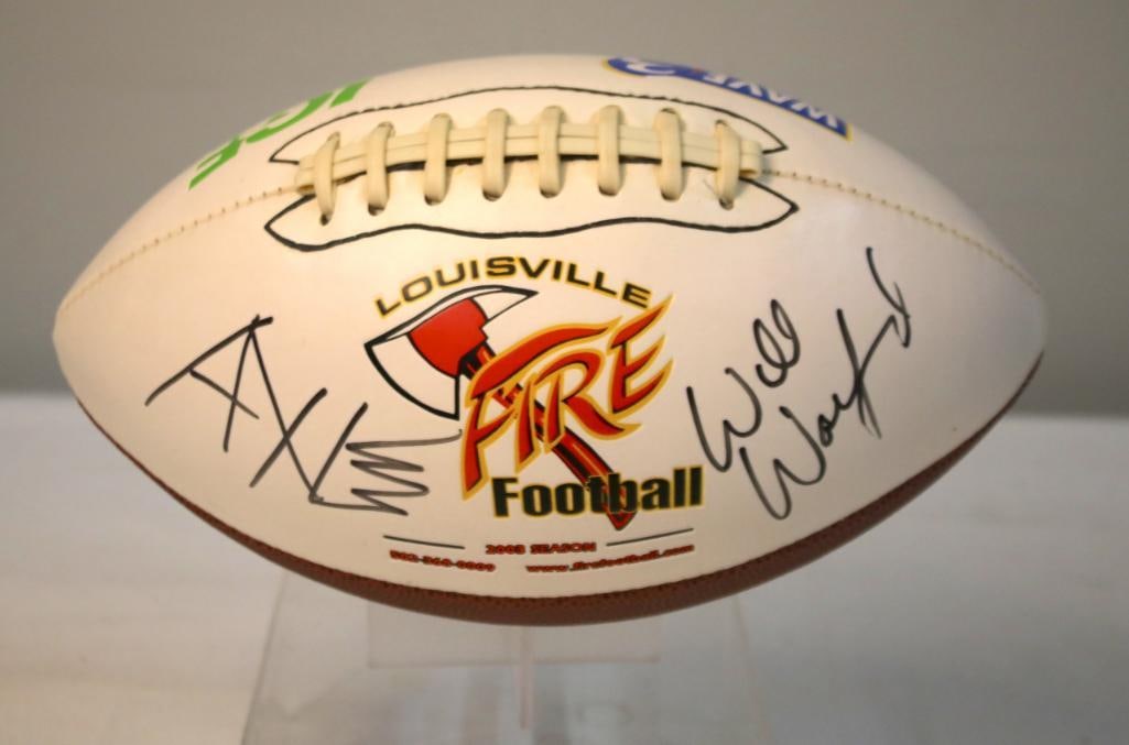 Louisville Fire Promotional Football, Signed by Will Wolford: White and brown Louisville Fire promotional football featuring team logo and sponsor graphics, signed in black marker by Will Wolford, with a second unidentified autograph also present. The Will Wolfo