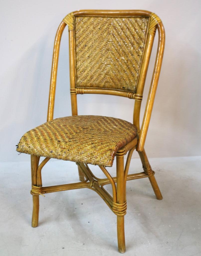 Rattan and Tiger Bamboo Side Chair: Constructed of tiger bamboo with naturally mottled striping, the arched back fitted with a woven rattan panel, above a woven rattan seat within a bamboo frame. The legs joined by stretchers and
