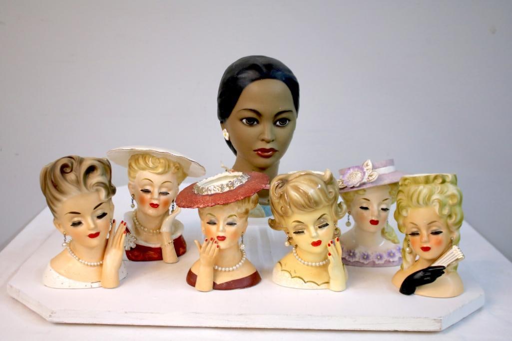 Seven Mid-Century Lady Head Vase Planters and One Bust: Group of seven ceramic lady head vase planters in mid-century style, each modeled as a woman with stylized coiffure and hat, including examples by Napco, Inarco, Rubens Originals, and other makers, to