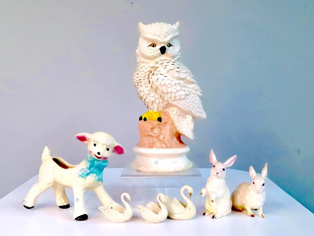 Group of Ceramic Animal & Bird Figural Decorations: Mid–late 20th century assortment of glazed ceramic figural pieces including a large white owl on stump base, lamb-form planter with blue ribbon, pair of seated rabbits, three miniature swans, and un