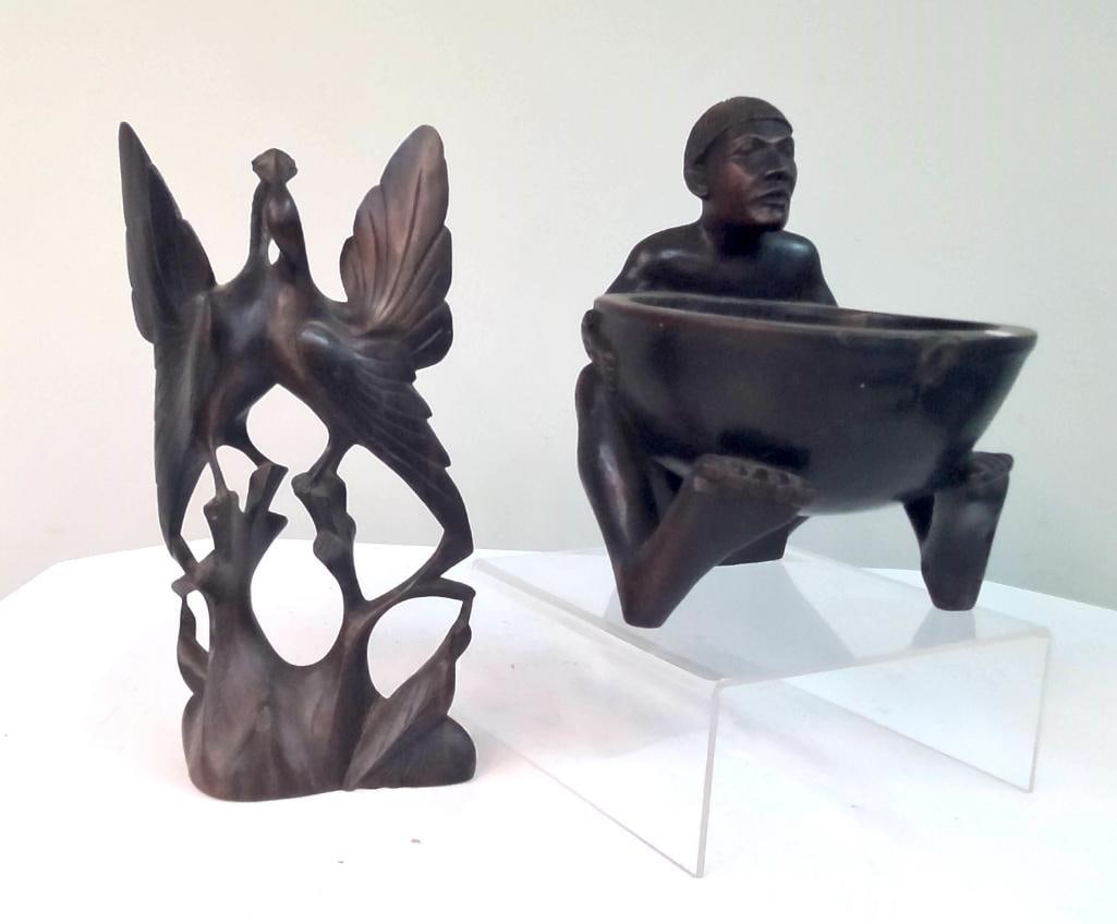 Two Carved Wood Sculptures, Figural Bowl and Bird Form: Group consisting of two carved wood sculptures, including a stylized figural form of a seated figure holding a bowl, executed in a modernist / tribal-inspired manner, and a carved bird perched on an