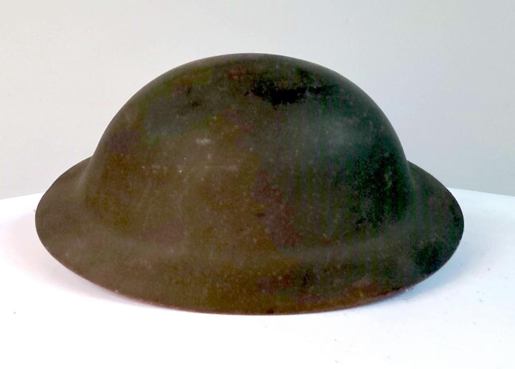 WWII U.S. Steel Helmet, Bailey “Victory?? Helmet Liner: Original U.S. military steel helmet with liner, consisting of a camouflaged M1-style steel shell and an early pressed-fiber liner bearing a “Victory Helmet – Bailey Hat Co.” label. The