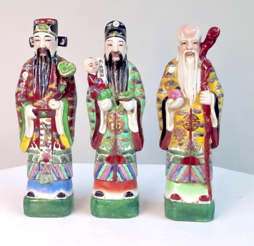 Chinese Porcelain Figures of the Three Star Gods: Set of three Chinese porcelain standing figures depicting the Three Star Gods—Fu (prosperity), Lu (status), and Shou (longevity)—each rendered in brightly enameled robes with traditional attribute