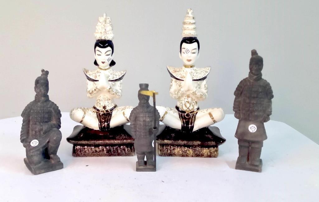 Decorative Asian Figural Group, Including Ceramic Deities and Terracotta-Style Soldiers: Mixed group including a pair of seated ceramic figures with hands in prayer, finished in cream glaze with gilt accents and stylized headdresses, together with three small terracotta-style warrior