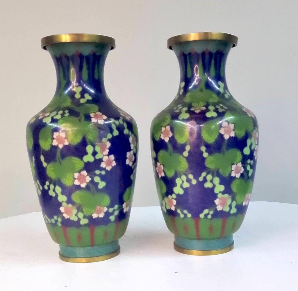 Pair of Cloisonné Enamel Vases with Floral Decoration: Pair of baluster-form cloisonné enamel vases, each with a deep cobalt blue ground decorated with stylized floral sprays and scrolling vines in polychrome enamels, including pink blossoms and green fo