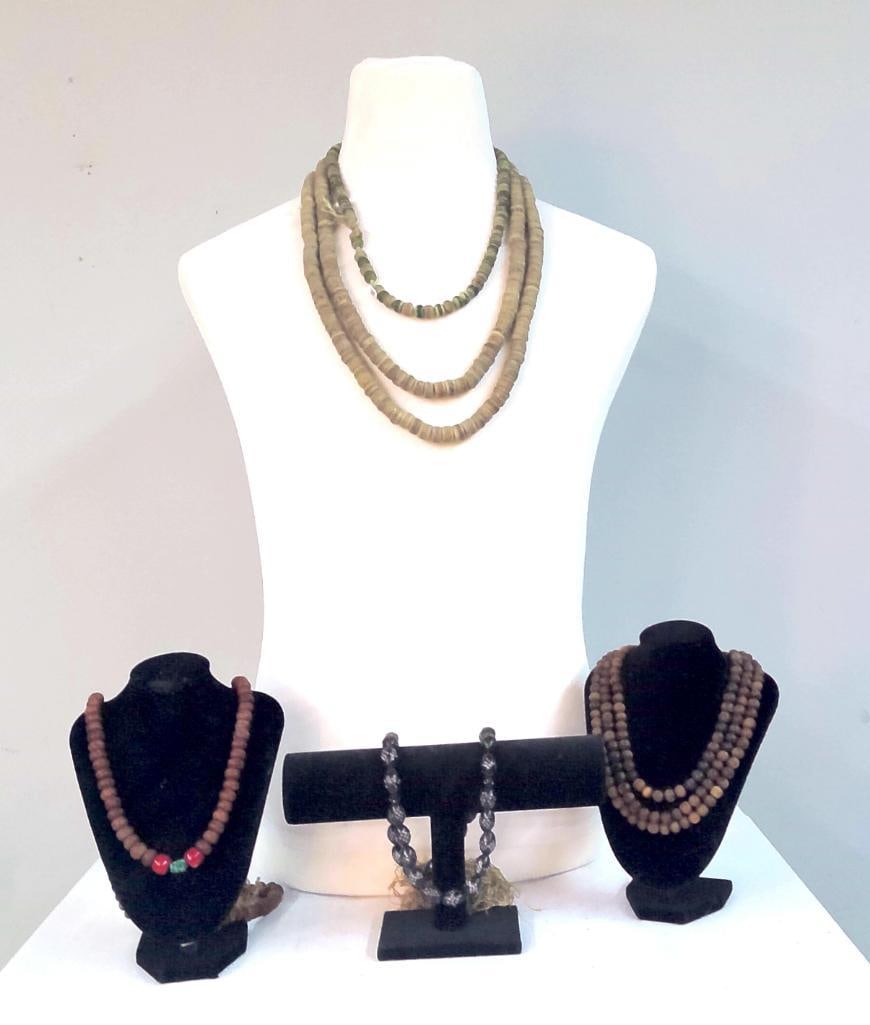 Three Strands of African Trade Beads: A group of three graduated strands of African trade beads, including a potential Millefoiri example, composed primarily of disk-form and rounded beads in muted earth tones, including examples with