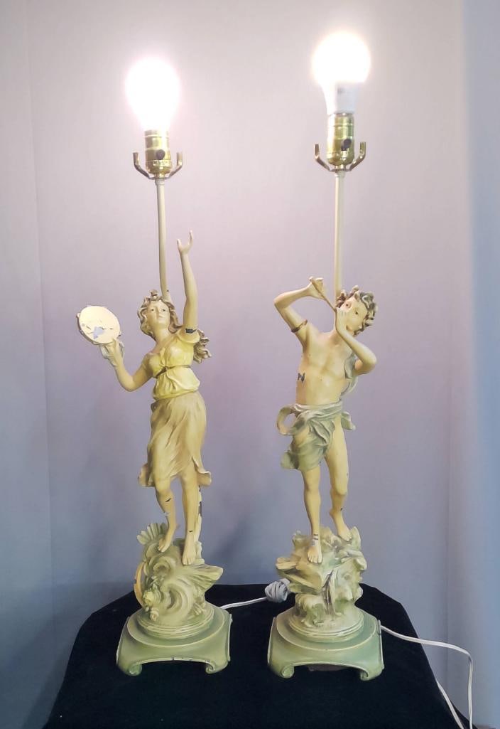 Pair of Collection Française Figural Table Lamps: Pair of molded composition figural table lamps, each modeled as a classical male and female figure—one playing a flute, the other holding a tambourine—standing on naturalistic bases with scrolling