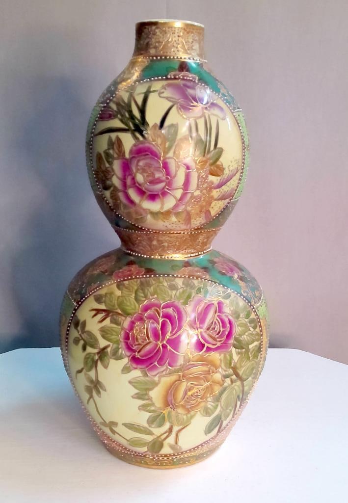 Satsuma Double-Gourd Form Vase with Floral Decoration: Porcelain double-gourd form vase decorated in the Satsuma style, featuring hand-painted roses and floral sprays within cartouches against a cream ground, with teal and gilt borders and extensive raise