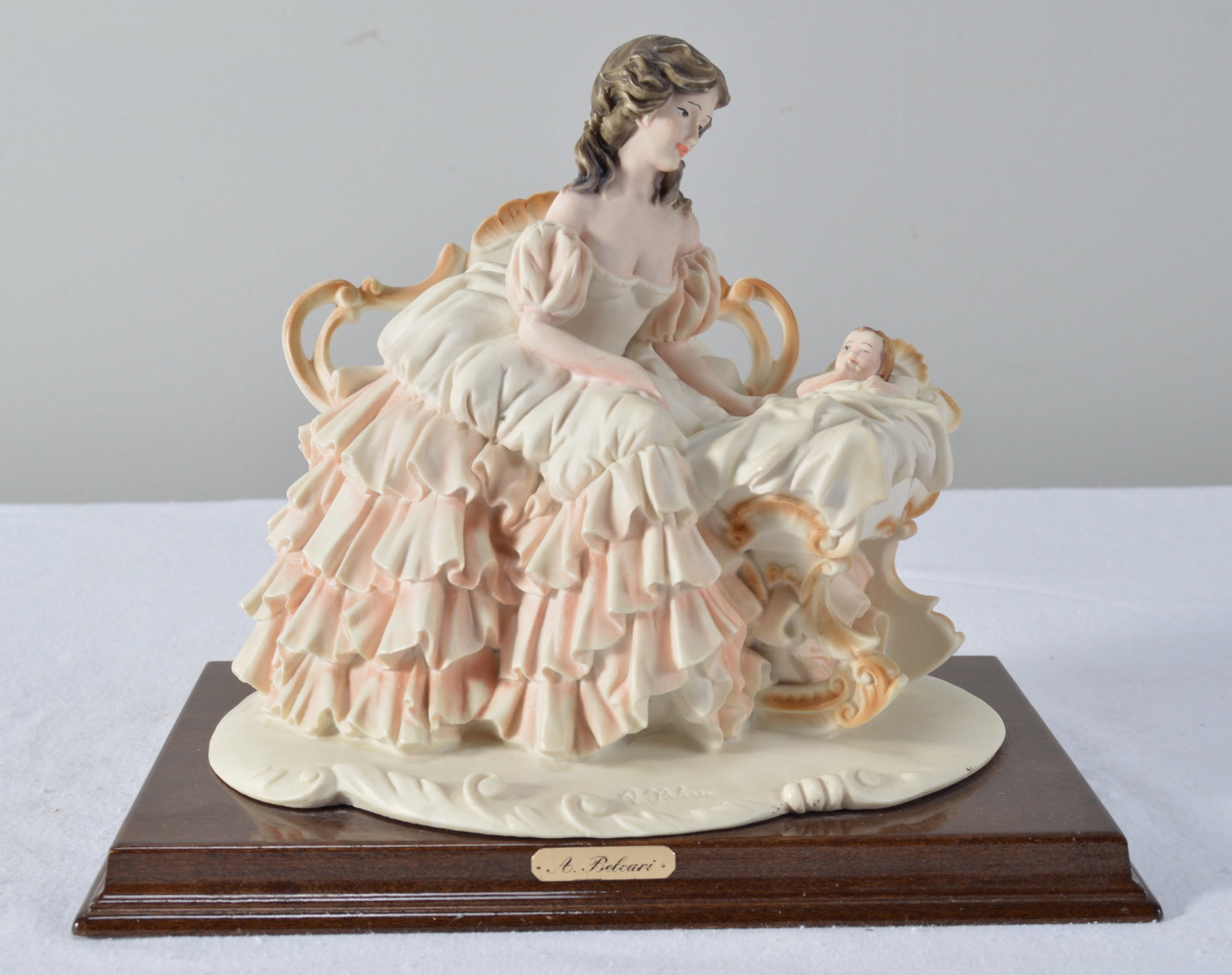 Berlcari Capodimonte Figurine: Large Colourway Auro Belcari Capodimonte Mother and Child Figurine Dimensions: H 9 x W 11 x D 7 inches NOTE: No apparent flaws