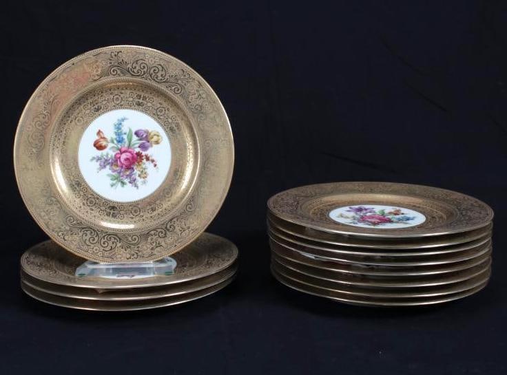 Twelve (12) Czech Epiag Gilt Encrusted Dinner Plates: Each with central hand painted bloom surrounded by rich gilt filigree Dimensions: H 1 x W 10.75 x D 10.75 inches NOTE: Some plates with slight scuffing to gilt