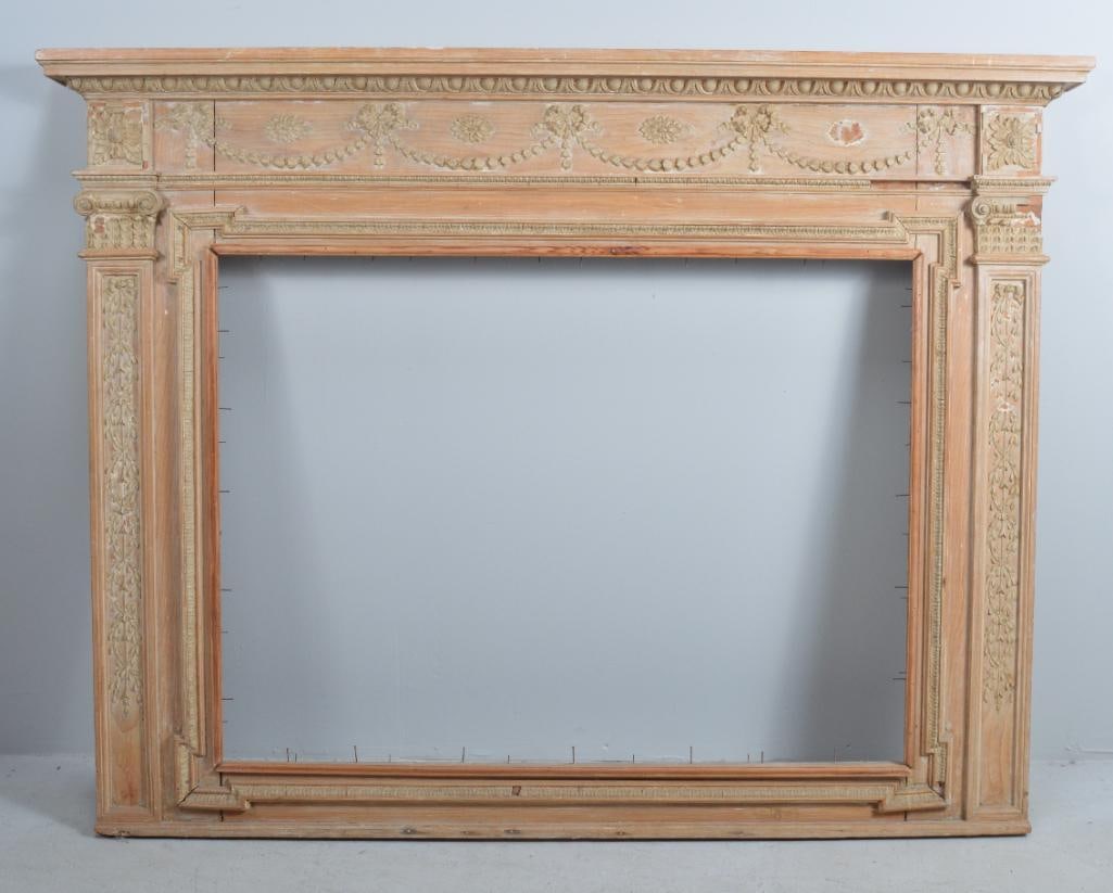 Architectual Over Mantel Frame: Pine, with ribbon, medallion and bellflower garland carvings to freize, scroll top columns with carved ribbons and bellflower. Dimensions: H 44 x W 58 x D 3 inches NOTE: Distressed and some loss as to