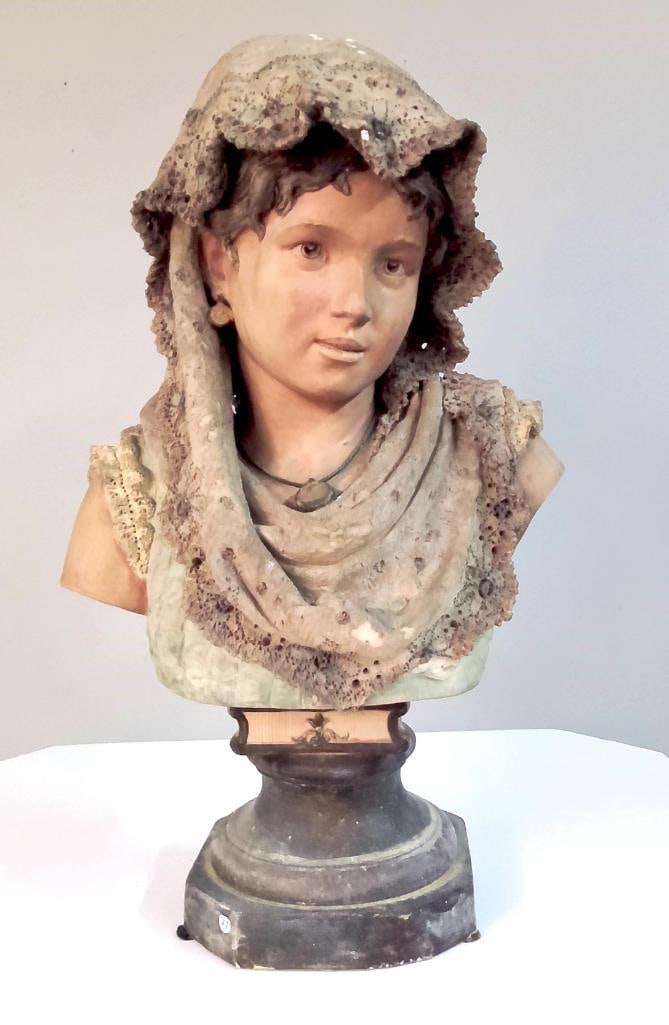Painted Plaster Bust of Young Woman with Lace Veil: Decorative bust depicting a young woman wearing a lace-edged veil and pendant necklace, the veil draped over the shoulders with pierced lace detailing. Hand-painted facial features and shaded colorati