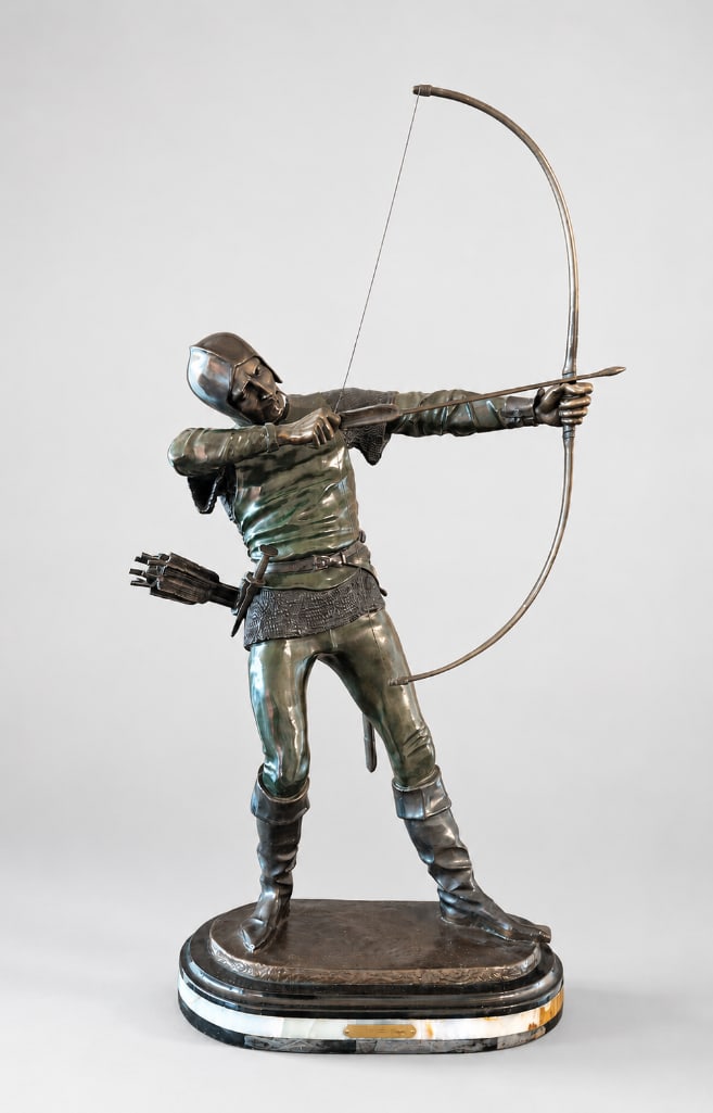 After Pierre-Nicolas Tourgueneff (French/Russian, 1853–1912): Bronze figure depicting a medieval archer drawing a longbow, modeled with chainmail armor, quiver, and sword. Signed "PIERRE TOURGUENEFF" to the bronze terrace and mounted on a shaped stone ba