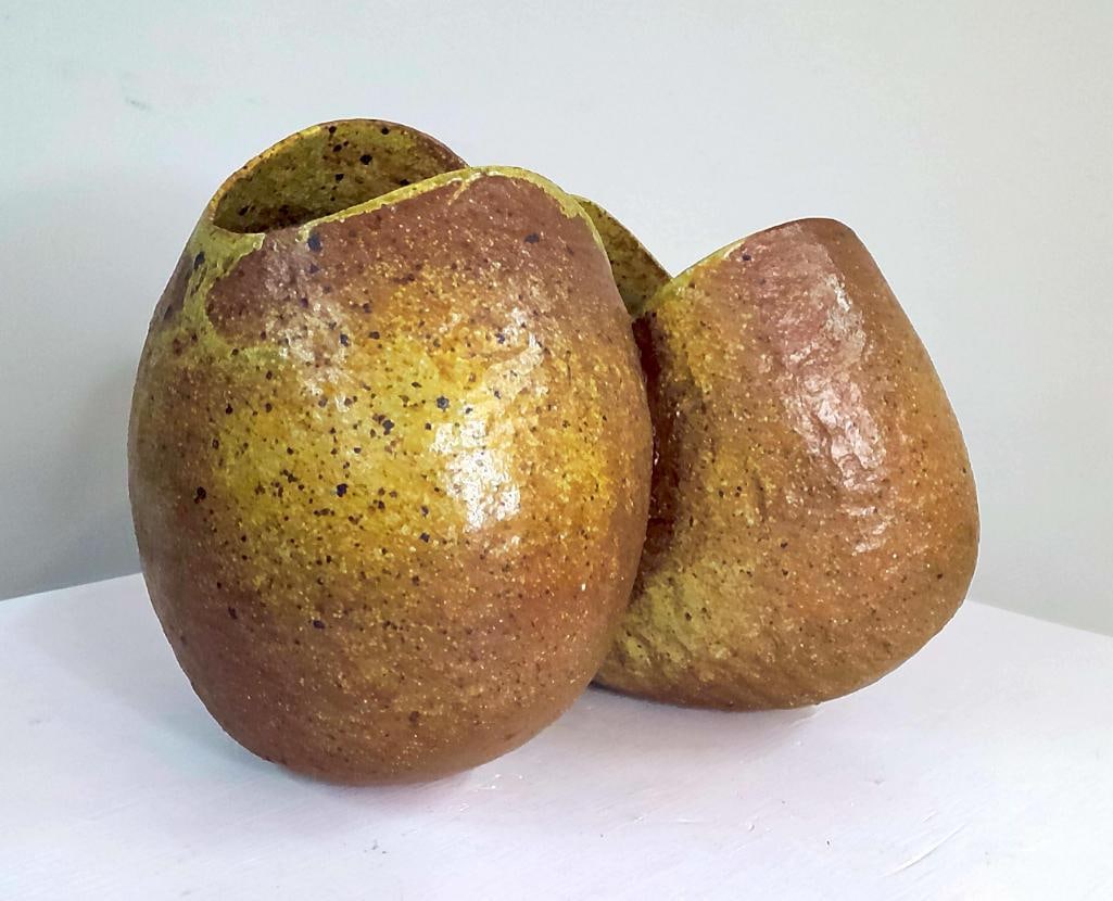 Modern Studio Pottery Double Pod Vessel: A pottery vessel of sculptural double-pod form, comprising two interconnected rounded chambers with asymmetrical organic openings. Finished in a variegated ochre, amber, olive, and iron-speckled glaze