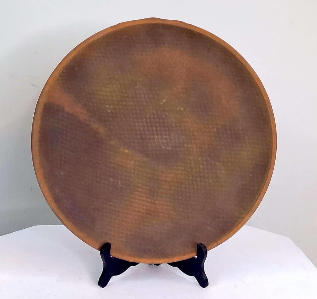 Sarah Frederick Earthenware Wall Charger: Large hand-thrown earthenware wall charger by Sarah Frederick, featuring a broad circular form with integrated hanging loop to the reverse. The front is decorated in a rich earth-tone palette of umber