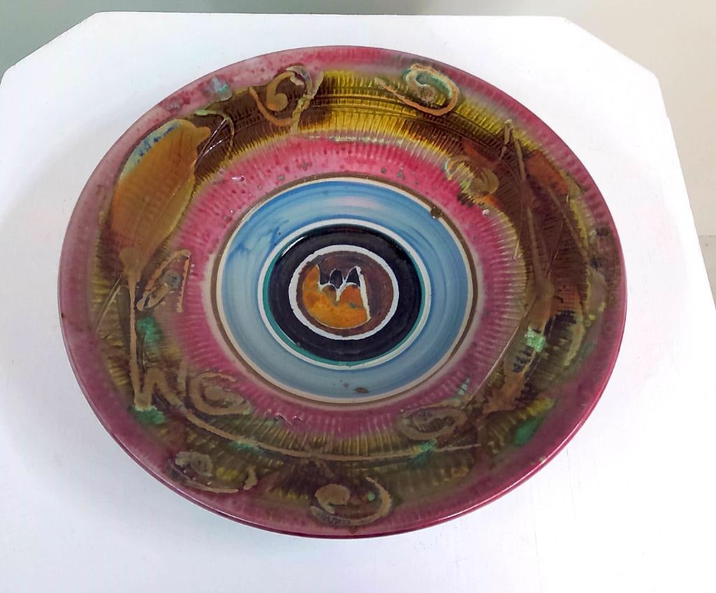 Contemporary Studio Pottery Platter: Possibly by Sarah Frederick. Large hand-thrown and hand-decorated stoneware platter featuring a vibrant concentric composition in magenta, turquoise, olive, amber, black, and cream glazes. The broad r