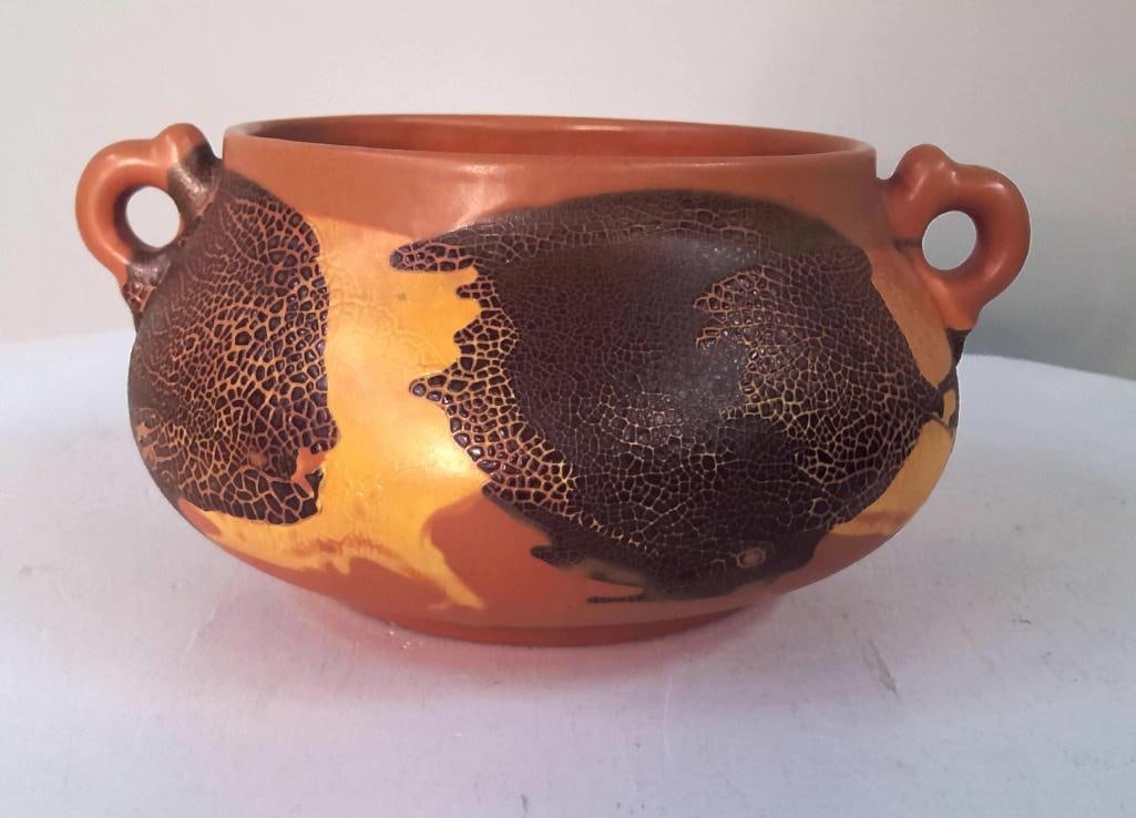 Royal Haeger Art Pottery Jardinière: American art pottery jardinière or cachepot, decorated with stylized skeletal leaf motifs in dark brown against a terracotta-orange ground, having twin scroll-form handles. Impressed Royal Haeger mar
