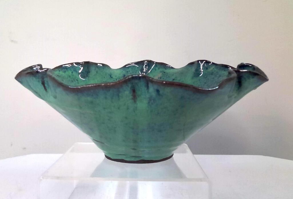 Studio Pottery Scalloped Rim Center Bowl: Hand-thrown studio pottery center bowl having a lobed scalloped rim and turquoise-green glazed surface with darker cobalt accents. Unmarked. Dimensions: H 5 x W 10 x D 10 inches NOTE: Good condition. 