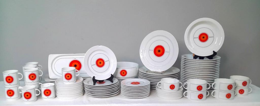Thomas Germany Porcelain Dinner Service, 82 Pieces: Modernist white "Eclipse" pattern porcelain dinner service decorated with concentric orange, red, and black target motifs. Manufactured by Thomas Germany. Comprising: 11 dinner plates 19 salad